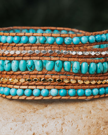 Treehut five-wrap bracelet is a true masterpiece, showcasing the natural beauty of Turquoise stone and Sterling Silver on genuine leather straps